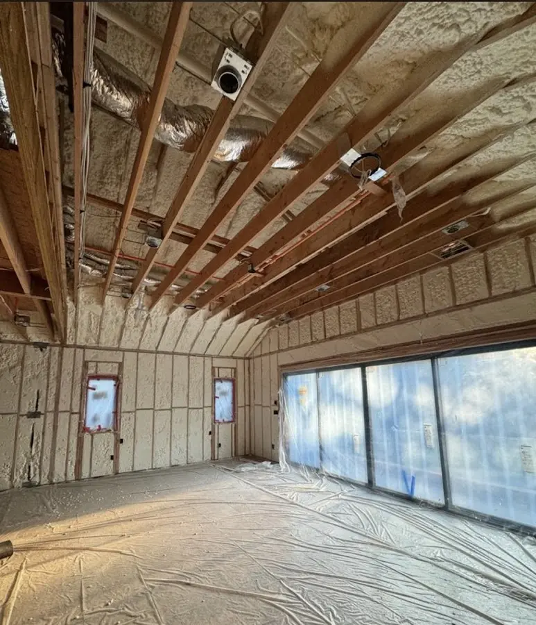Interior walls and ceiling insulated with spray foam during new construction in North Londonderry